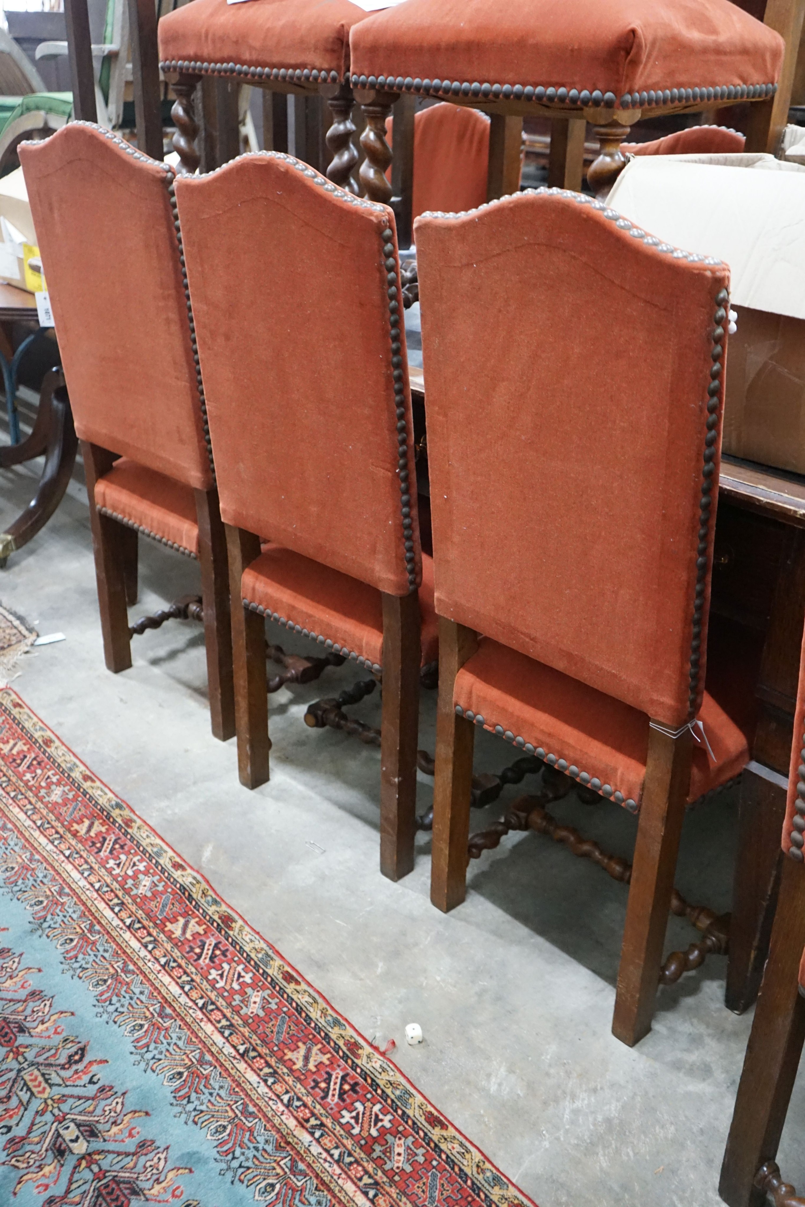 A set of ten Carolean design upholstered oak dining chairs
